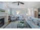 Open-concept living room with cozy fireplace, lots of natural light, and hardwood floors at 1066 High Point Ne Dr, Atlanta, GA 30306