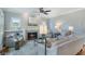 Inviting living room with fireplace, ceiling fan, and built-in bookshelves at 1066 High Point Ne Dr, Atlanta, GA 30306