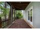 Exterior porch features wood decking, wood-beam ceiling, privacy fence, and backyard views at 1066 High Point Ne Dr, Atlanta, GA 30306