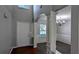 Open entryway with views of dining room featuring elegant chandelier and large window at 2153 Pine View Trl, Ellenwood, GA 30294