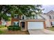 Charming brick-front home featuring a two-car garage and well-maintained landscaping at 2153 Pine View Trl, Ellenwood, GA 30294