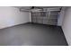 View of the garage featuring an automatic door opener and newly painted floor at 2153 Pine View Trl, Ellenwood, GA 30294