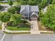 Aerial view of a neighborhood showcasing a two-story home with a well-maintained front yard at 251 Parc Dr, Canton, GA 30114