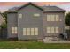 Back exterior of home with multiple windows and a patio area, perfect for outdoor enjoyment at 251 Parc Dr, Canton, GA 30114