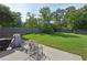 The backyard offers a patio area with seating, perfect for outdoor entertaining and relaxation at 251 Parc Dr, Canton, GA 30114