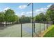 Exterior view of a fenced basketball court in a community with surrounding trees at 251 Parc Dr, Canton, GA 30114