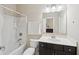Clean bathroom featuring a bathtub, shower, a mirror, and a vanity at 251 Parc Dr, Canton, GA 30114
