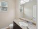 Well-lit bathroom with a granite countertop and neutral decor at 251 Parc Dr, Canton, GA 30114