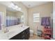 Modern bathroom with double sink vanity, large mirror, and shower/tub combination at 251 Parc Dr, Canton, GA 30114