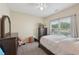 Inviting bedroom with natural light, soft carpeting, and neutral color scheme at 251 Parc Dr, Canton, GA 30114
