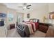 Well-lit bedroom featuring a ceiling fan, a cozy bed, and an exterior balcony at 251 Parc Dr, Canton, GA 30114