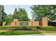 Elegant brick entrance to a neighborhood, The Park at Steels Bridge, with manicured landscaping at 251 Parc Dr, Canton, GA 30114