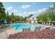 Community pool area with ample lounge chairs and a pool house, perfect for a relaxing day at 251 Parc Dr, Canton, GA 30114