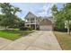Charming two-story home featuring a double-decker porch, well-maintained lawn, and inviting curb appeal at 251 Parc Dr, Canton, GA 30114