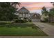 Charming two-story home featuring a welcoming front porch, well-maintained lawn, and a two-car garage at 251 Parc Dr, Canton, GA 30114