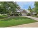 Charming two-story home featuring a double-decker porch, well-maintained lawn, and inviting curb appeal at 251 Parc Dr, Canton, GA 30114