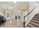 Bright foyer featuring hardwood floors, elegant lighting, and an open view into the adjacent living spaces at 251 Parc Dr, Canton, GA 30114