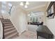 Open foyer featuring stairs, a table, and an arched entrance to the living room at 251 Parc Dr, Canton, GA 30114