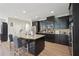 Beautiful kitchen with granite countertops, dark cabinets and stainless steel appliances at 251 Parc Dr, Canton, GA 30114