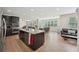 Kitchen featuring stainless appliances, granite counters, and dark wood cabinets at 251 Parc Dr, Canton, GA 30114