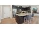 Kitchen featuring stainless appliances, granite counters, and dark wood cabinets at 251 Parc Dr, Canton, GA 30114