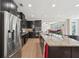 Kitchen featuring stainless appliances, granite counters, and dark wood cabinets at 251 Parc Dr, Canton, GA 30114