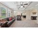 Open living area with coffered ceiling, lots of natural light, and comfortable furniture at 251 Parc Dr, Canton, GA 30114