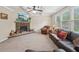 Bright living room with stone fireplace, coffered ceiling, and multiple windows at 251 Parc Dr, Canton, GA 30114