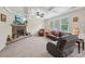 Spacious living room with a stone fireplace, coffered ceiling, and large windows at 251 Parc Dr, Canton, GA 30114