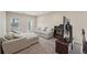 Comfortable living room featuring a sofa, chair, TV, and an open doorway at 251 Parc Dr, Canton, GA 30114