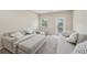 Cozy upstairs loft area with sofas, accent pillows, windows, and carpet flooring at 251 Parc Dr, Canton, GA 30114