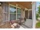 Inviting front porch with brick accents and comfortable seating, perfect for enjoying the outdoors at 251 Parc Dr, Canton, GA 30114
