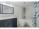 Modern bathroom featuring marble countertop vanity, sleek toilet, and tiled shower with tub at 2657 Lenox Ne Rd # A-5, Atlanta, GA 30324