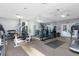 Gym featuring modern exercise equipment, mirrored wall, and ceiling fan at 2657 Lenox Ne Rd # A-5, Atlanta, GA 30324