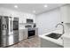 Well-lit kitchen with stainless steel appliances, light gray cabinets, and a modern faucet at 2657 Lenox Ne Rd # A-5, Atlanta, GA 30324