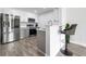 Modern kitchen features stainless steel appliances, gray cabinets, and breakfast bar with a stool at 2657 Lenox Ne Rd # A-5, Atlanta, GA 30324