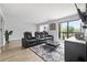 Bright living room with large windows, wood floors, and comfortable seating at 2657 Lenox Ne Rd # A-5, Atlanta, GA 30324