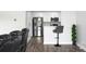 Living room view showcases modern kitchen area, hardwood floors, gray walls, and comfortable seating at 2657 Lenox Ne Rd # A-5, Atlanta, GA 30324
