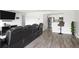 Open living room area offers view to modern kitchen, comfortable seating, and hardwood floors at 2657 Lenox Ne Rd # A-5, Atlanta, GA 30324