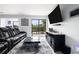 Spacious living room featuring a plush area rug, large screen TV, and bright natural light at 2657 Lenox Ne Rd # A-5, Atlanta, GA 30324