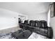 Modern living room with gray wood floors, open concept and plush seating at 2657 Lenox Ne Rd # A-5, Atlanta, GA 30324