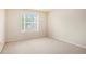 Neutral bedroom featuring a large window that provides plenty of light at 3185 Highgreen Trl, Atlanta, GA 30349