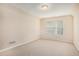 Bright bedroom with neutral walls, soft carpeting, and a window that provides plenty of light at 3185 Highgreen Trl, Atlanta, GA 30349