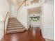 Inviting foyer with hardwood and carpeted staircase, filled with natural light at 3185 Highgreen Trl, Atlanta, GA 30349