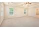 Large main bedroom featuring neutral carpet and generous natural light at 3185 Highgreen Trl, Atlanta, GA 30349