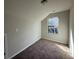 Small bedroom with gray carpeted floors, a single window, and light-colored walls at 4287 Traipse Path, Ellenwood, GA 30294