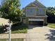 Charming two-story home with a two-car garage and a well-maintained lawn in a suburban neighborhood at 4287 Traipse Path, Ellenwood, GA 30294