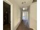 Hallway with multiple doors, access to attic, and carpeted floors at 4287 Traipse Path, Ellenwood, GA 30294