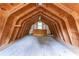 Spacious unfinished attic featuring exposed beams and a window, offering renovation potential at 1652 Weymouth Ct, Tucker, GA 30084