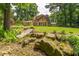 View of home showing brick, patio and professionally landscaped yard at 1652 Weymouth Ct, Tucker, GA 30084